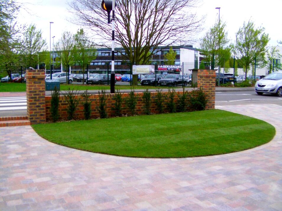 Tegula driveway with lawn by ecospaces